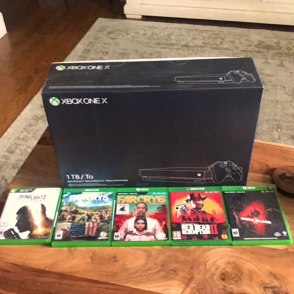 XBOX ONE X refurbished. 1 terabyte memory hard drive. 1 controller and 5 games!